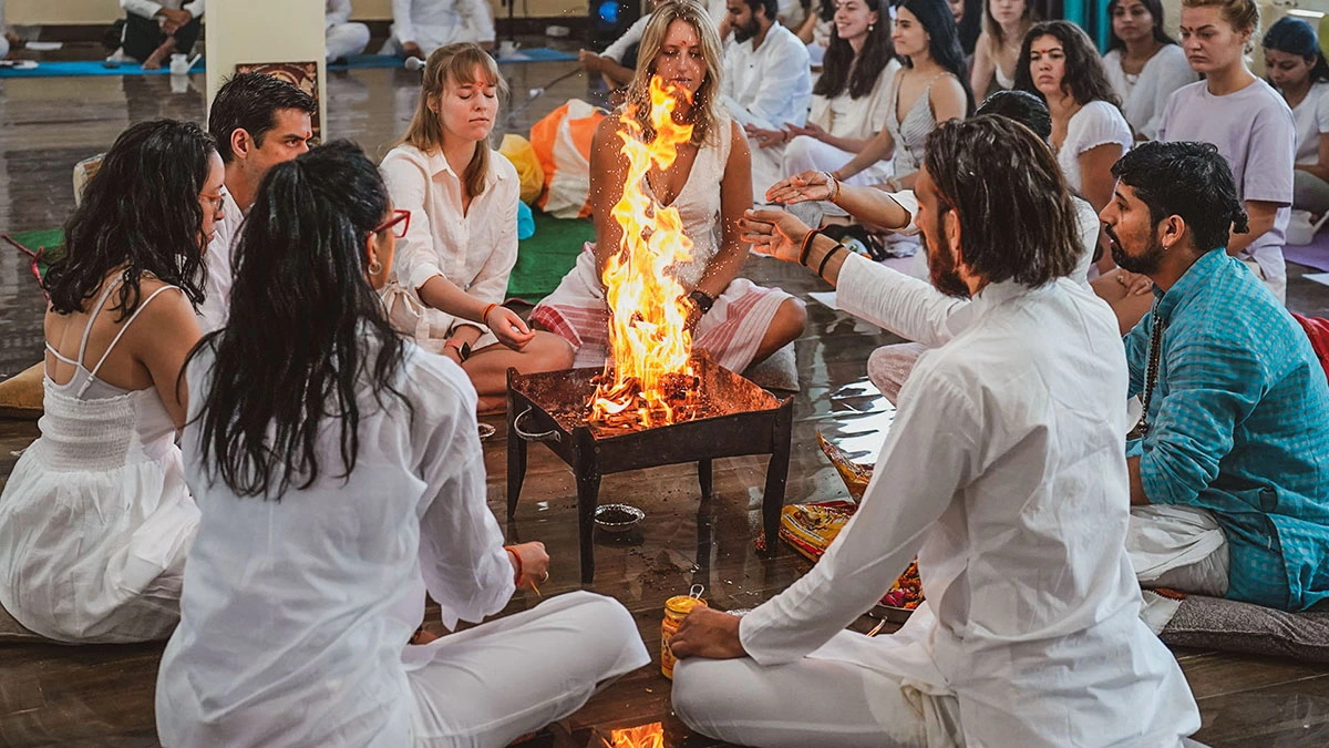 havan fire ceremony during yoga teacher training course at rishikesh yog temple